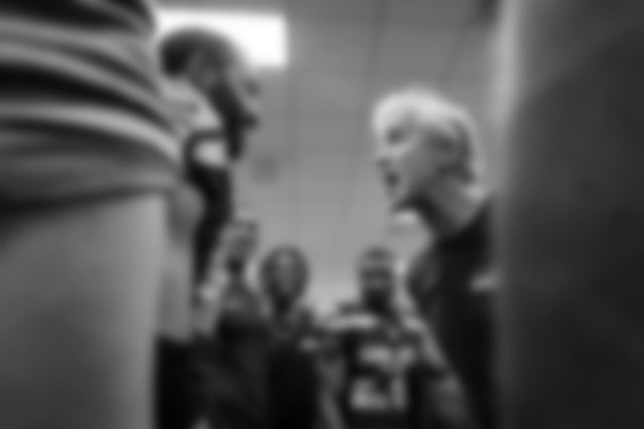 In the victorious Seahawks locker room, head coach Pete Carroll yells in the direction of receiver Doug Baldwin.