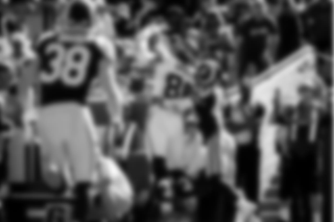 Seattle's Jimmy Graham outlaws the smaller John Johnson III of the Rams for a touchdown reception.