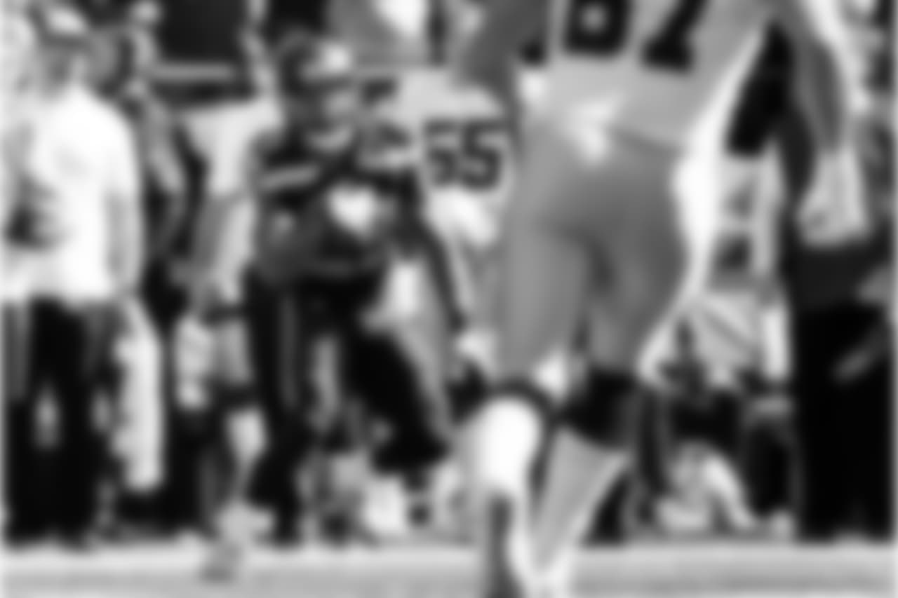 Safety Earl Thomas returns the first of his two interceptions on the day.