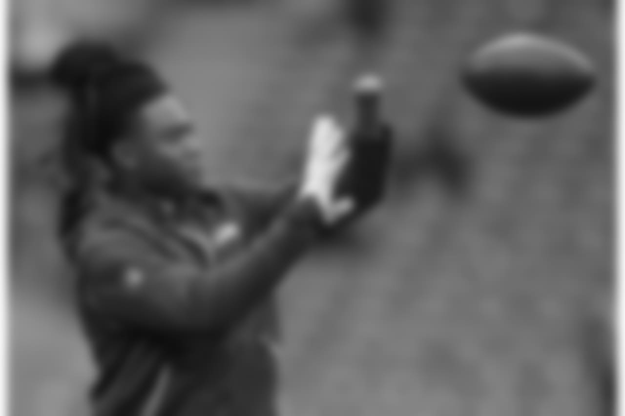 Seattle Seahawks linebacker Shaquem Griffin (49) catches the ball during the warm-up before an NFL football game against Oakland Raiders at Wembley stadium in London, Sunday, Oct. 14, 2018. (AP Photo/Matt Dunham)