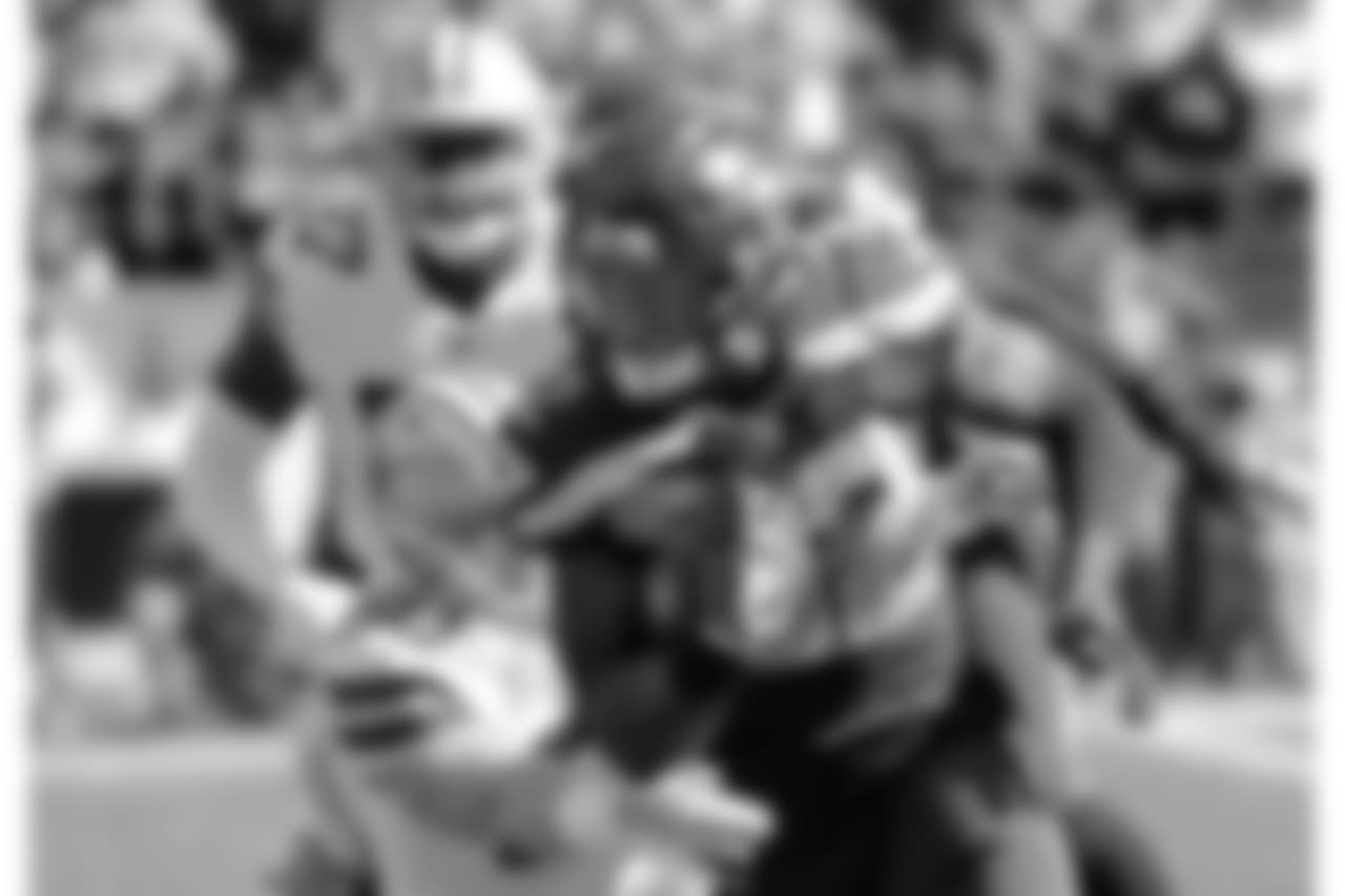 FILE - In this Sunday, Sept. 23, 2018, file photo, Seattle Seahawks running back Chris Carson rushes against the Dallas Cowboys during the first half of an NFL football game in Seattle. Carson rushed for 102 yards in the game. In consecutive weeks, the Seahawks produced 100-yard rushers. The novelty was it being two different backs, neither of which was rookie first-round pick Rashaad Penny. (AP Photo/Elaine Thompson, File)