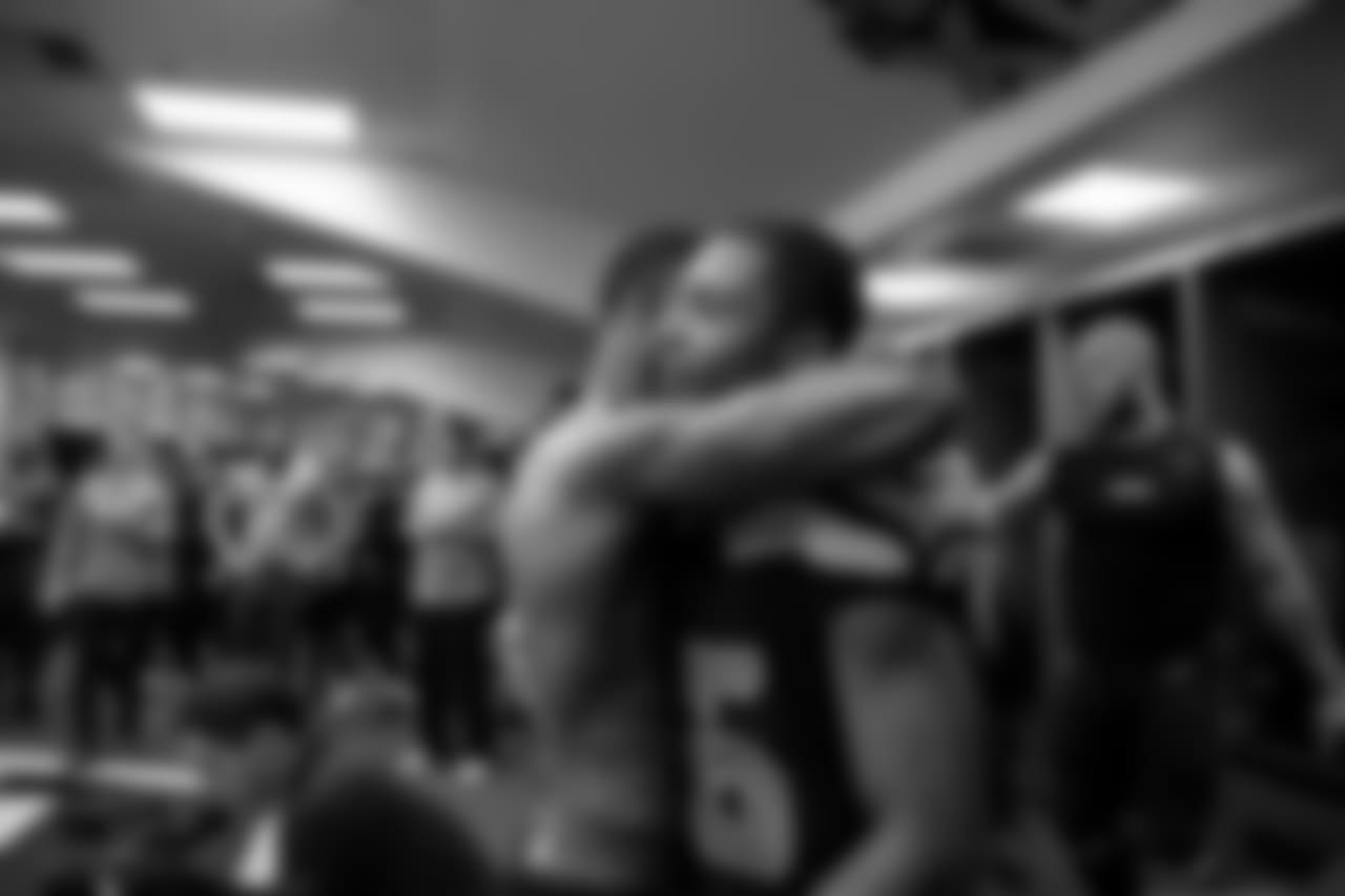 Seahawks receiver Tyler Lockett receives an embrace from teammate Paul Richardson in the locker room after the game.
