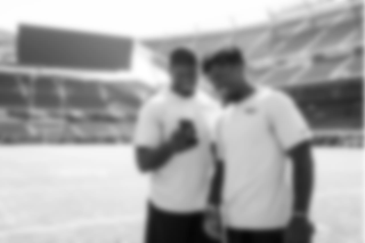 Seahawks rookies Rasheem Green and Jacob Martin share a laugh at Soldier Field during the team's visit on Sunday afternoon.