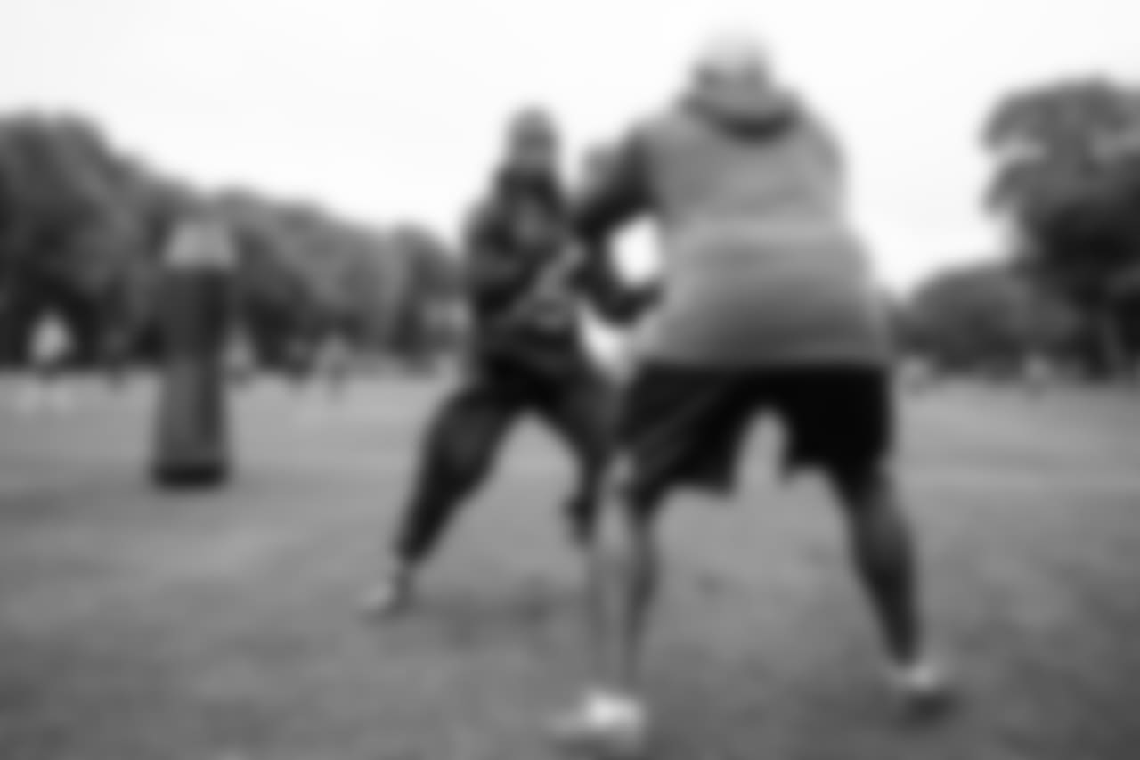 At the team's first practice in London, defensive end Dion Jordan worked with assistant coach Jethro Franklin.