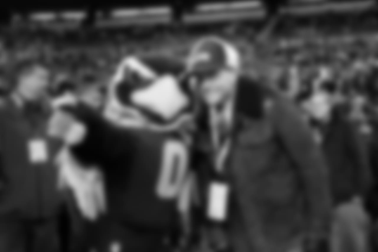 Seahawks mascot "Blitz" chats with television personality Joel McHale before the game. McHale was raised in Seattle and is an avid 12.