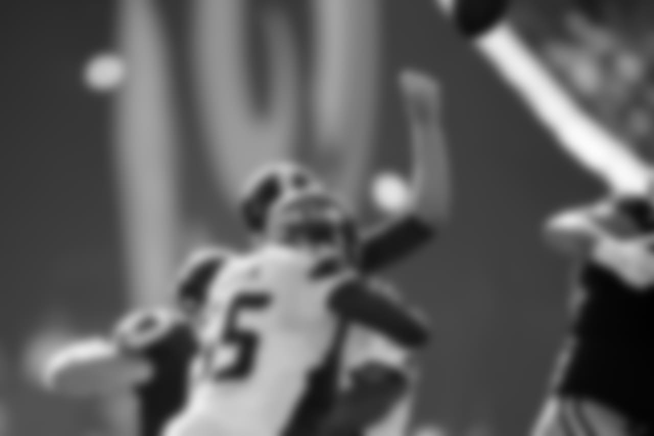 Seattle's Frank Clark knocks the ball away from Rams quarterback Jared Goff in the fourth quarter.