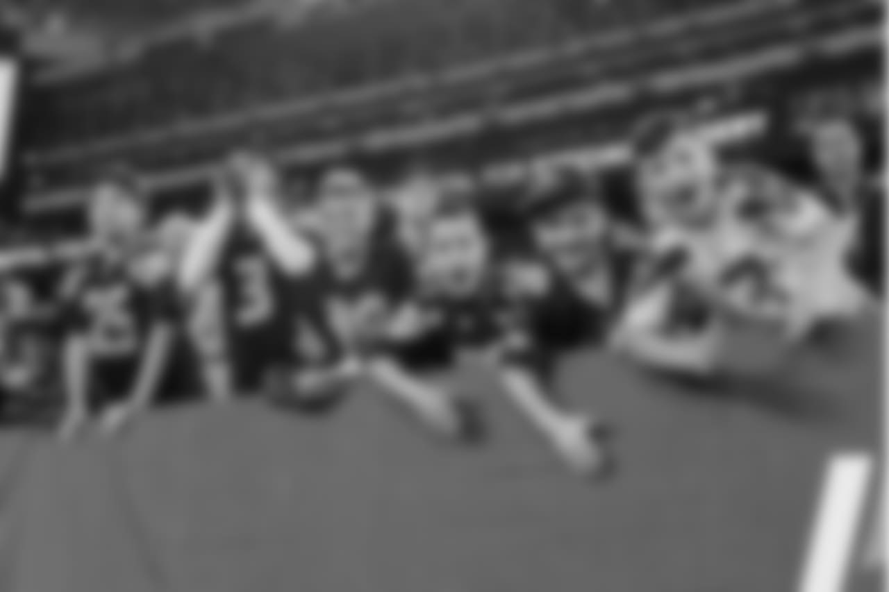 These young 12s yelled and pounded the padding behind the Seahawks bench to fire up their favorite team.