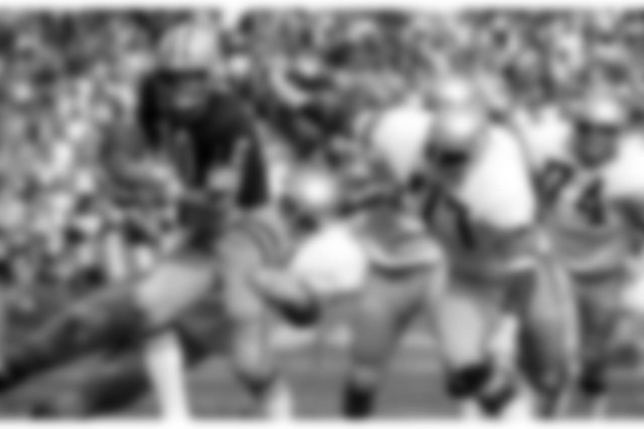 Green Bay Packers quarterback Lynn Dickey (10) is sacked by Seattle Seahawks defensive tackle Steve Niehaus (71) and defensive tackle Richard Harris (77) during an NFL game in Green Bay on October 10, 1976 . The Packers defeated the Seahawks 27-20. (AP Photo/Vernon Biever)
