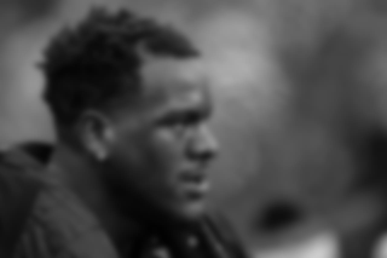 Defensive end Frank Clark stays warm on the sidelines between series.