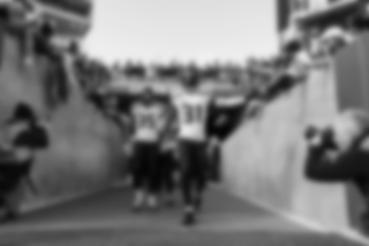 Safety Kam Chancellor leads the defensive backs on to the field for warmups.