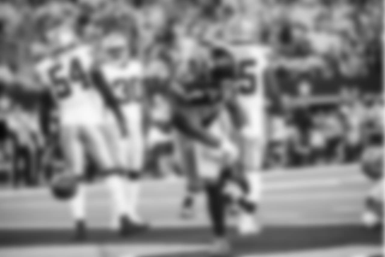 Seattle's Mike Davis spikes the ball after scoring on a successful two-point conversion.