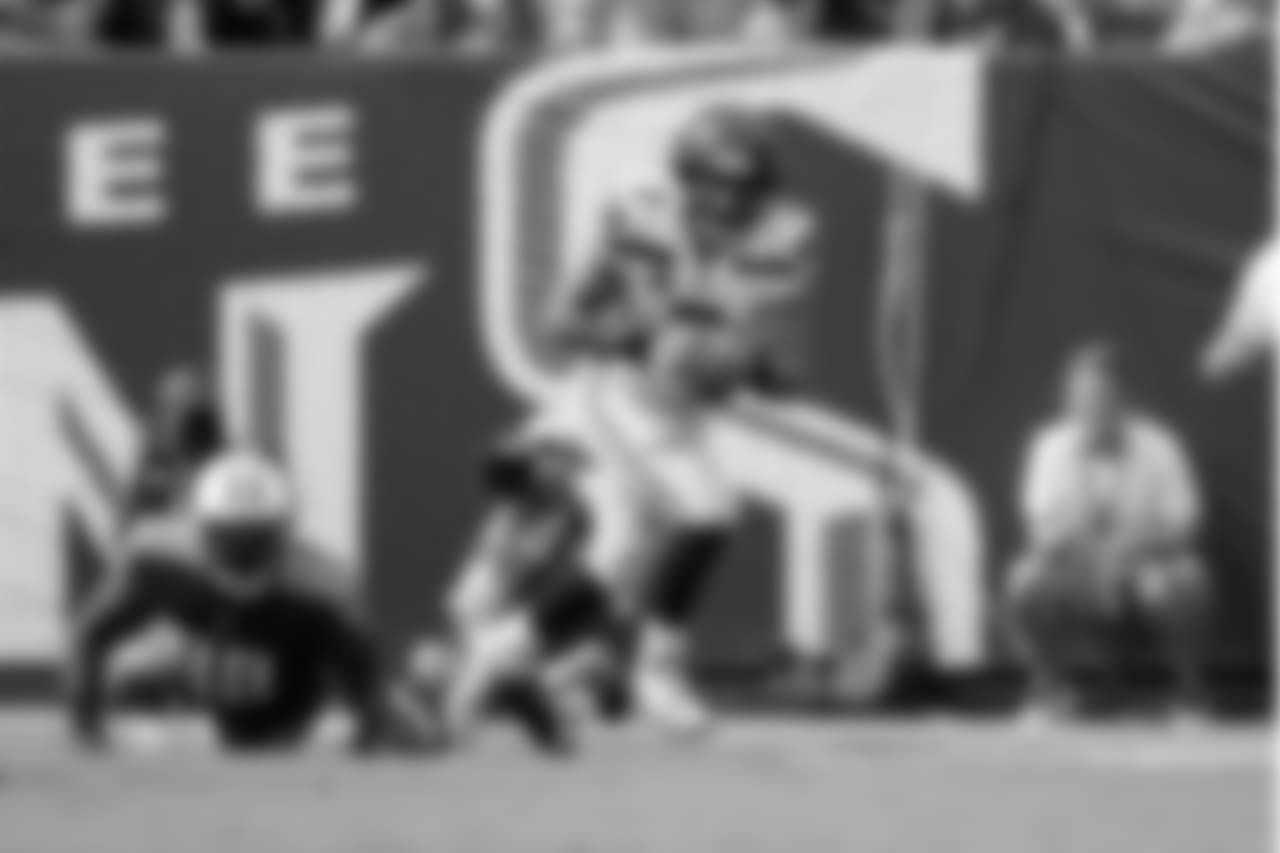 Quarterback Russell Wilson leaves the pocket on a scramble in the first quarter.