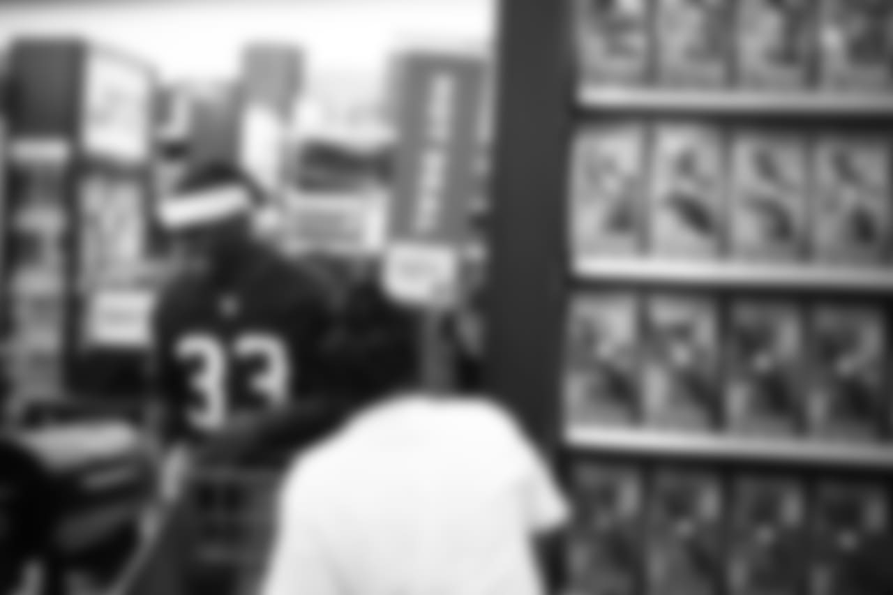 An image from a Dec. 18, 2018 community development event in which Texans rookie players shopped for Christmas gifts with Texans YMCA students.