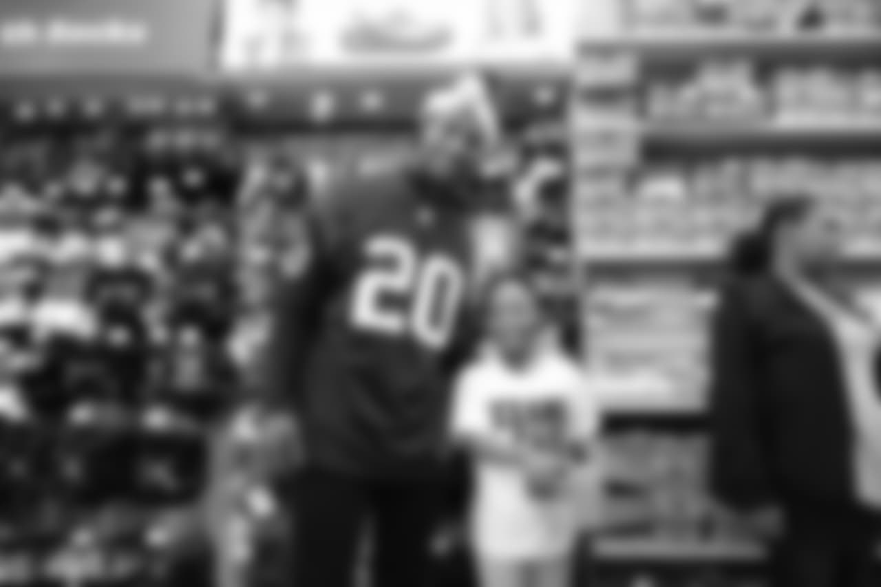 An image from a Dec. 18, 2018 community development event in which Texans rookie players shopped for Christmas gifts with Texans YMCA students.