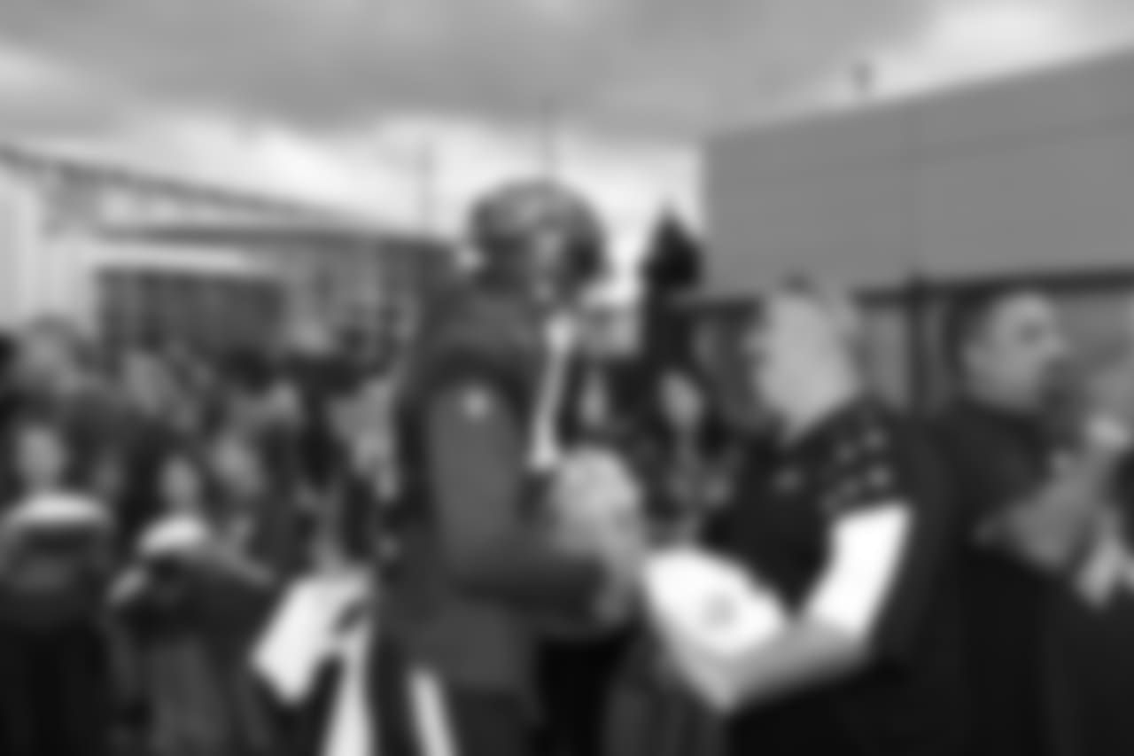 A Nov. 23, 2018 image of a community development event in which military families visited a Texans practice.