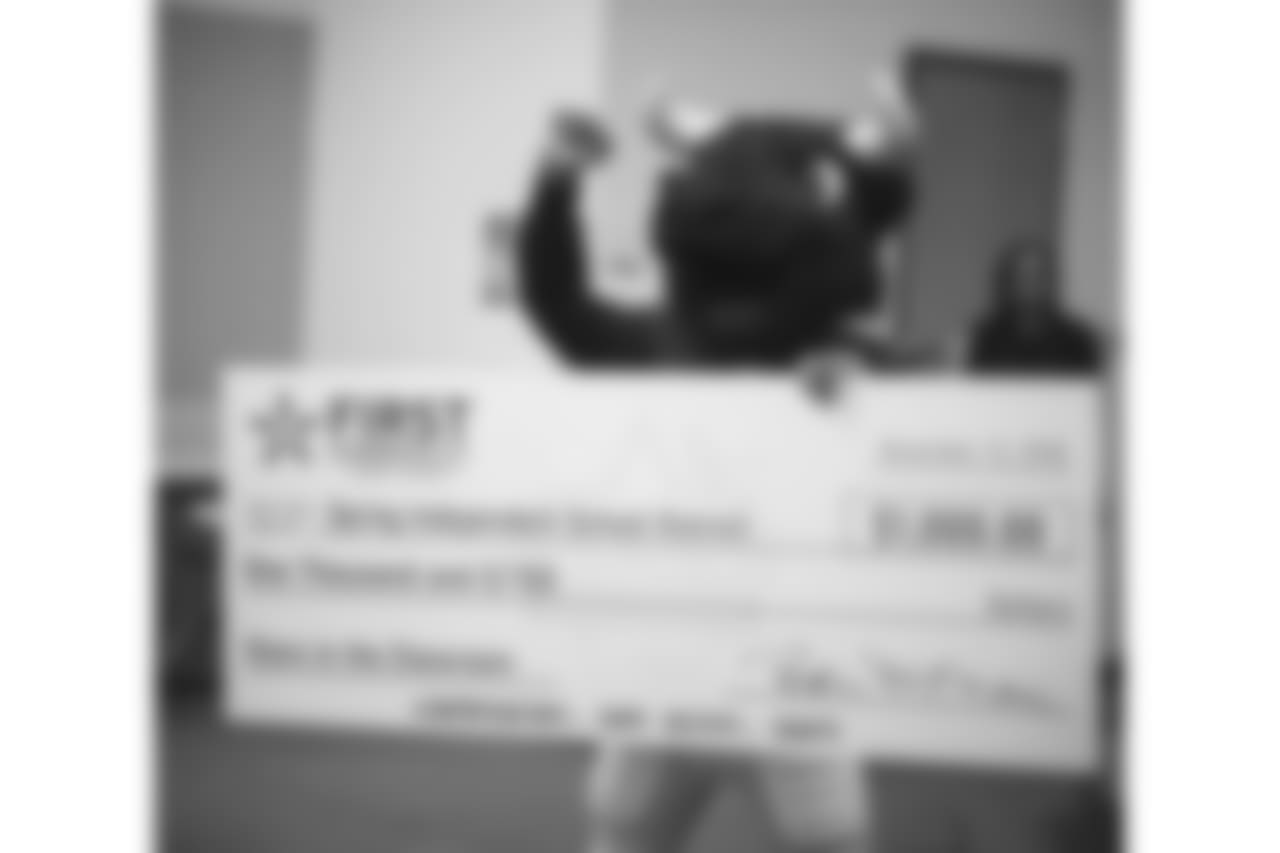 An image from the Nov. 13, 2018 corporate development event at Hirsch Elementary School in Spring, TX. Brian Peters, TORO, and cheerleaders visited the students and presented awards and a big check to teachers.