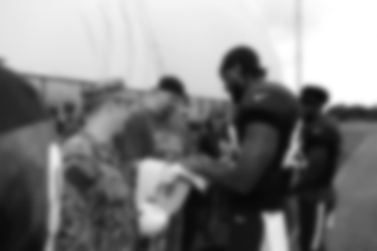 A Nov. 23, 2018 image of a community development event in which military families visited a Texans practice.