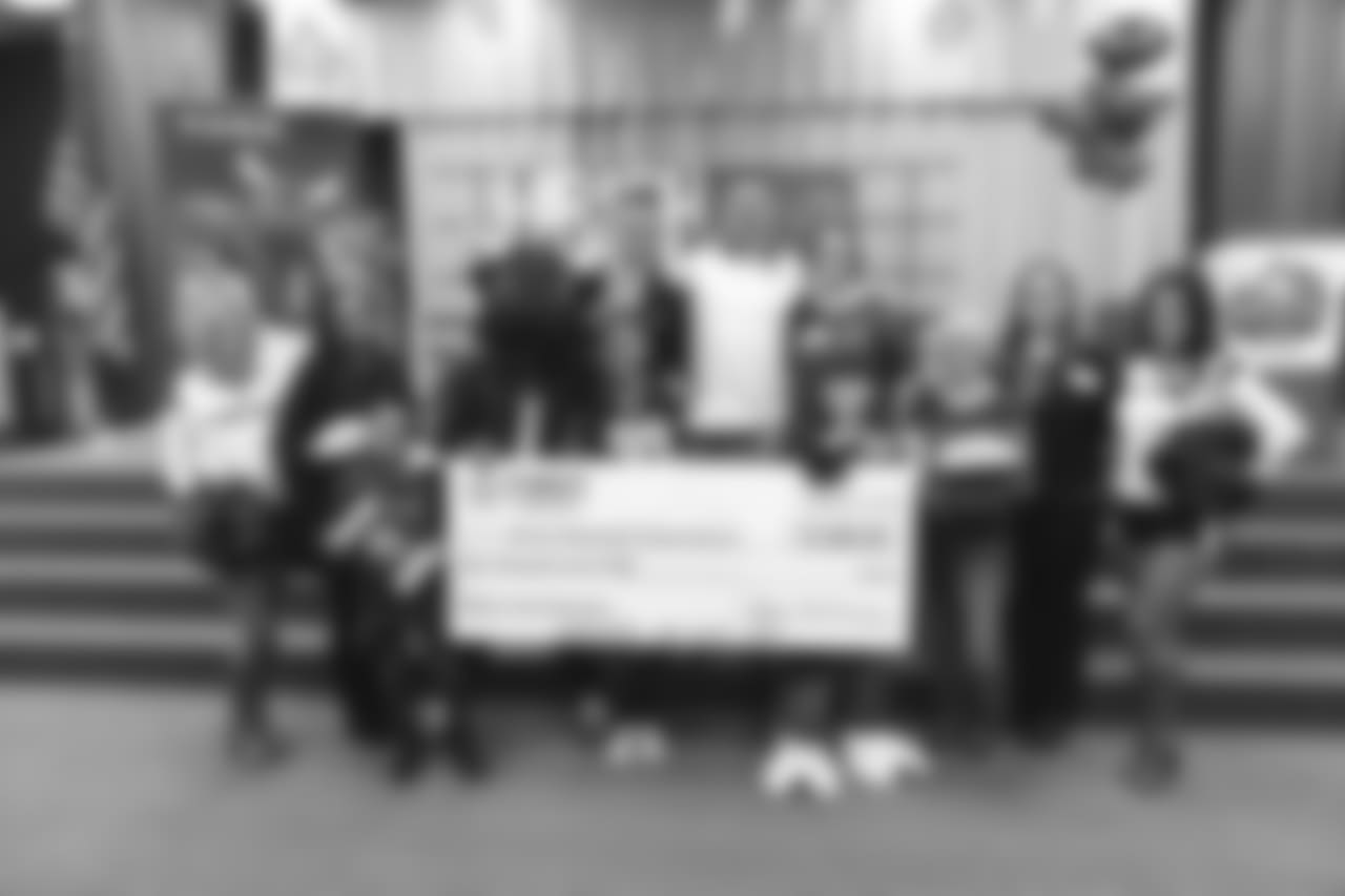 An image from the Nov. 13, 2018 corporate development event at Hirsch Elementary School in Spring, TX. Brian Peters, TORO, and cheerleaders visited the students and presented awards and a big check to teachers.