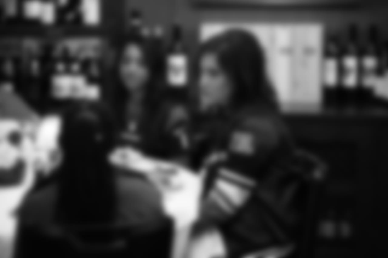 An image from the Oct. 18, 2018 community development event in which the Lady Texans learned about dinner ettiequte with Houston-area students.