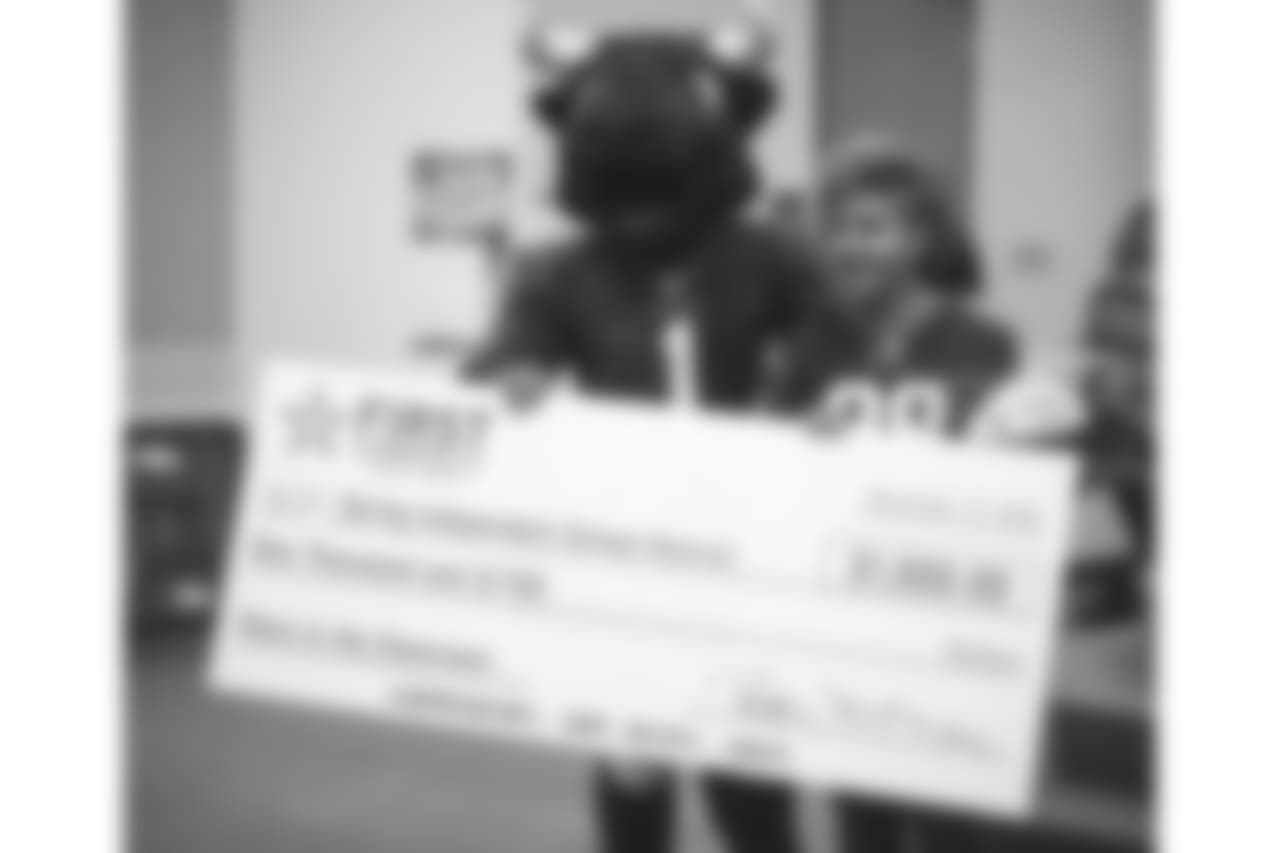 An image from the Nov. 13, 2018 corporate development event at Hirsch Elementary School in Spring, TX. Brian Peters, TORO, and cheerleaders visited the students and presented awards and a big check to teachers.