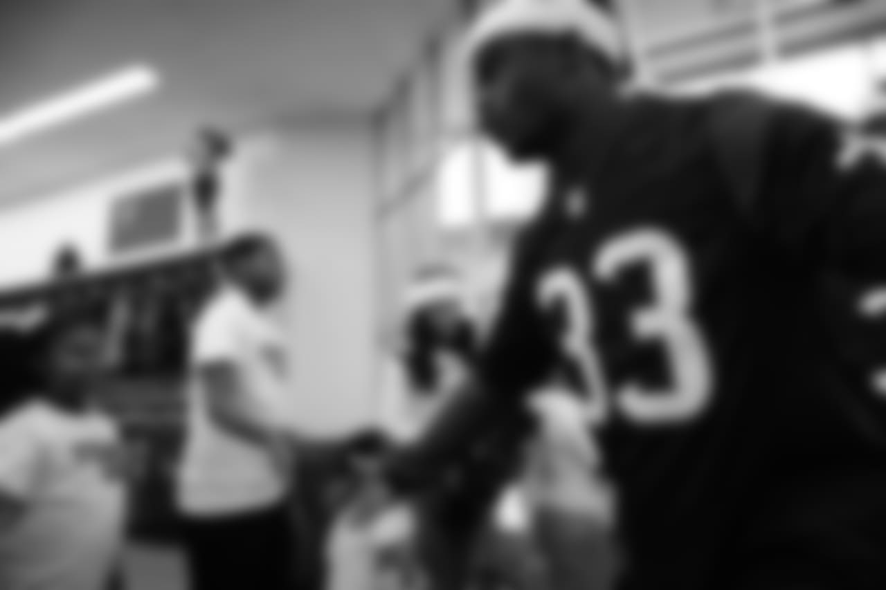 An image from a Dec. 18, 2018 community development event in which Texans rookie players shopped for Christmas gifts with Texans YMCA students.