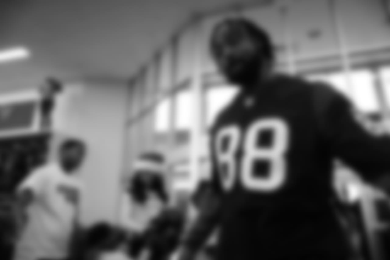 An image from a Dec. 18, 2018 community development event in which Texans rookie players shopped for Christmas gifts with Texans YMCA students.