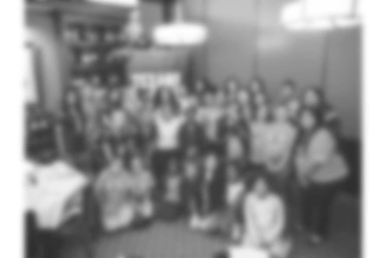 An image from the Oct. 18, 2018 community development event in which the Lady Texans learned about dinner ettiequte with Houston-area students.