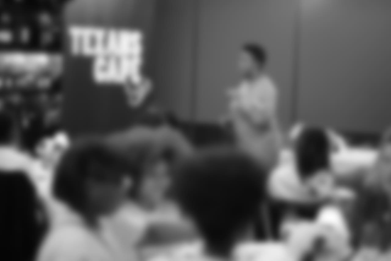 An image from the Oct. 18, 2018 community development event in which the Lady Texans learned about dinner ettiequte with Houston-area students.