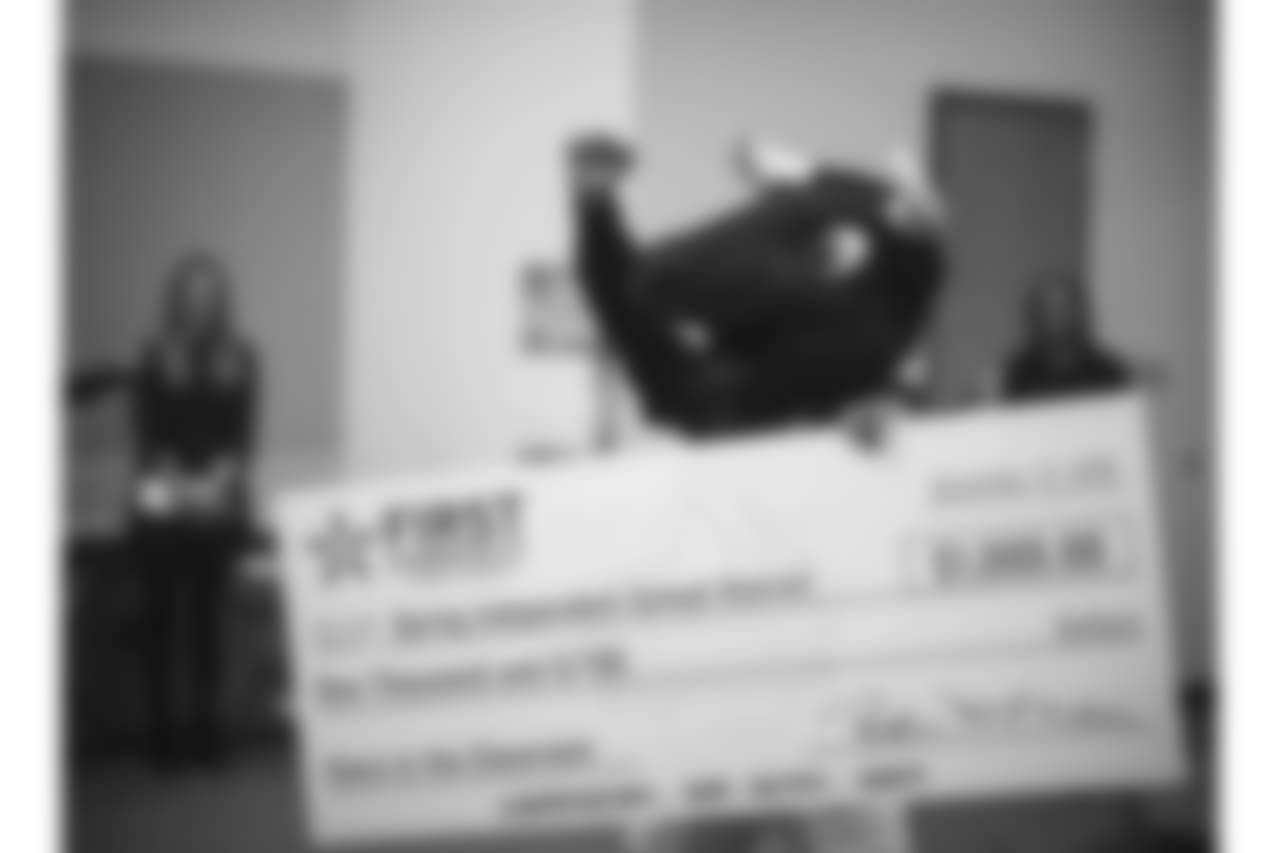 An image from the Nov. 13, 2018 corporate development event at Hirsch Elementary School in Spring, TX. Brian Peters, TORO, and cheerleaders visited the students and presented awards and a big check to teachers.