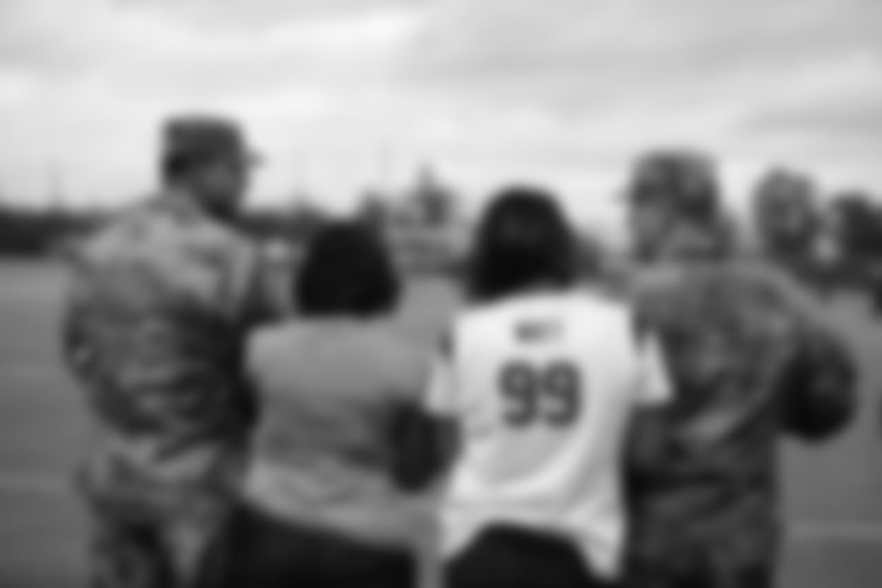A Nov. 23, 2018 image of a community development event in which military families visited a Texans practice.