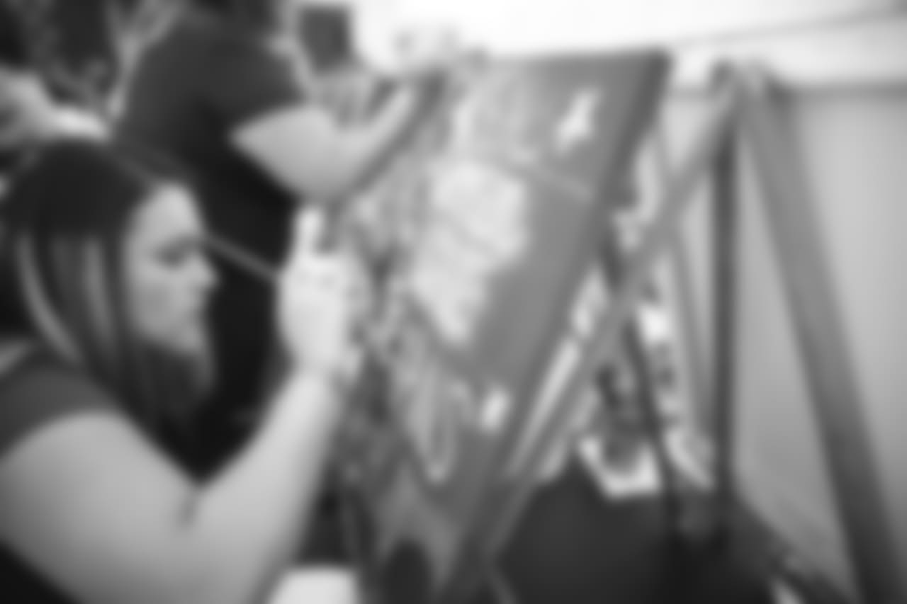 A July 15, 2018 image of the Battle Red Ladies' "Down, Set, Paint!" event held inside the the indoor practice field.