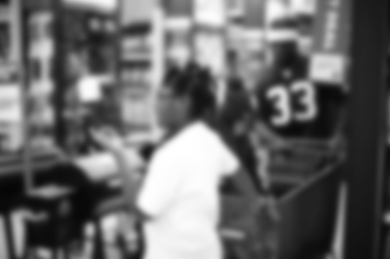 An image from a Dec. 18, 2018 community development event in which Texans rookie players shopped for Christmas gifts with Texans YMCA students.
