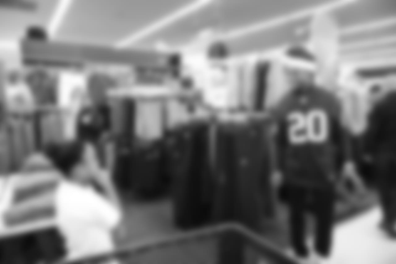 An image from a Dec. 18, 2018 community development event in which Texans rookie players shopped for Christmas gifts with Texans YMCA students.