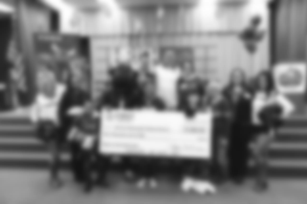 An image from the Nov. 13, 2018 corporate development event at Hirsch Elementary School in Spring, TX. Brian Peters, TORO, and cheerleaders visited the students and presented awards and a big check to teachers.