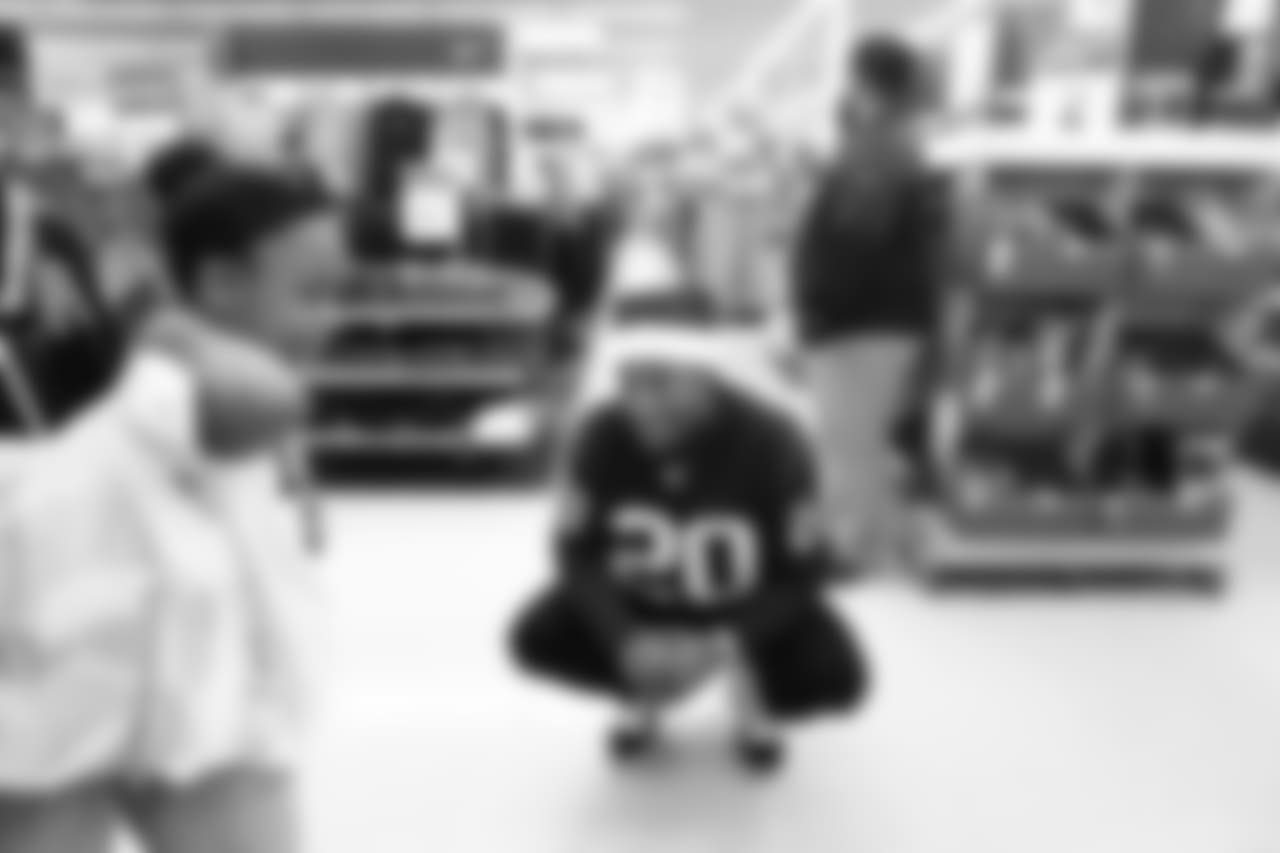 An image from a Dec. 18, 2018 community development event in which Texans rookie players shopped for Christmas gifts with Texans YMCA students.