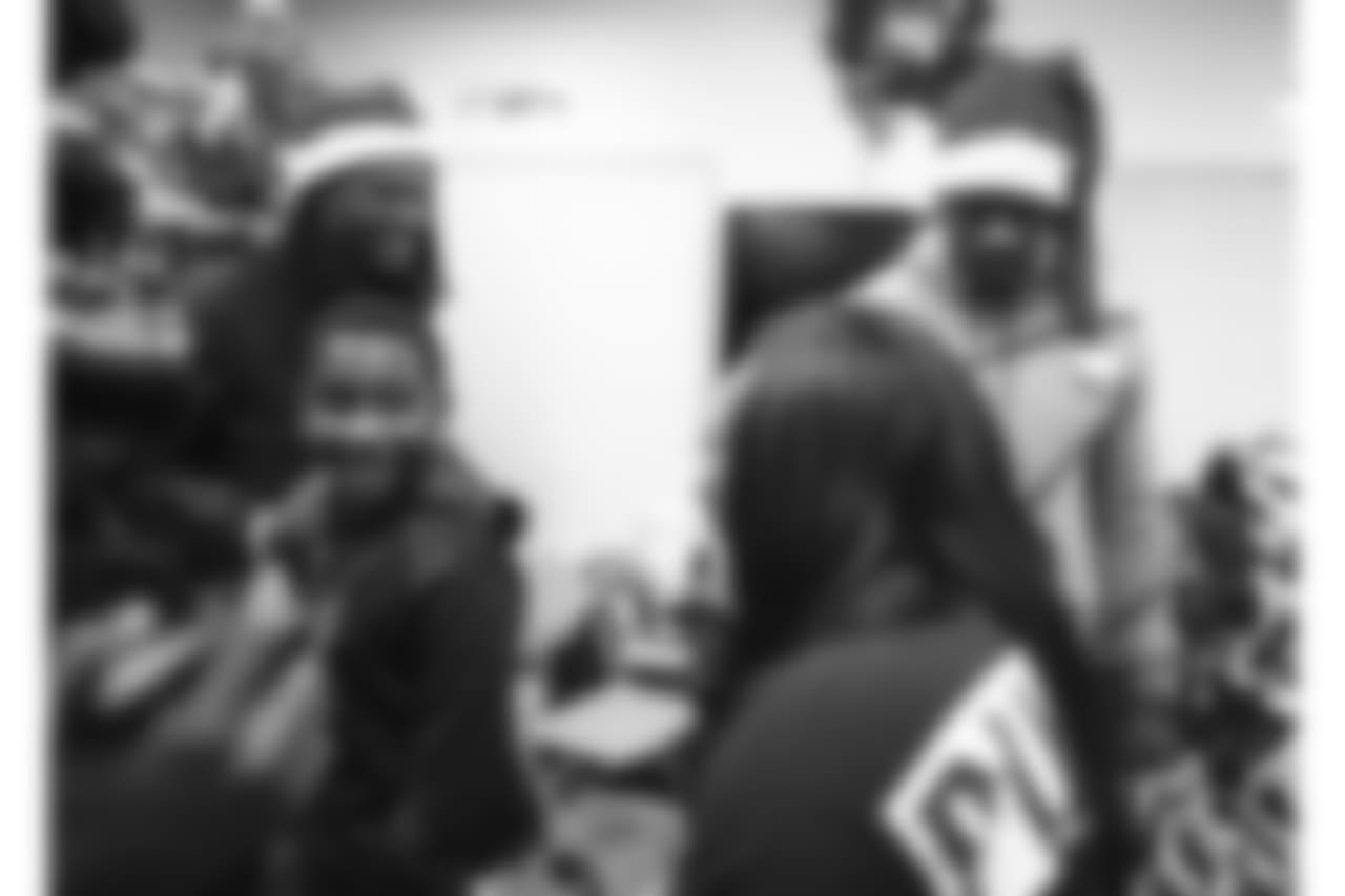 An image from the Dec. 21, 2018 community development event at the Madge Bush Transitional Living Center. Andre Johnson and DeAndre Hopkins gave gifts to families.