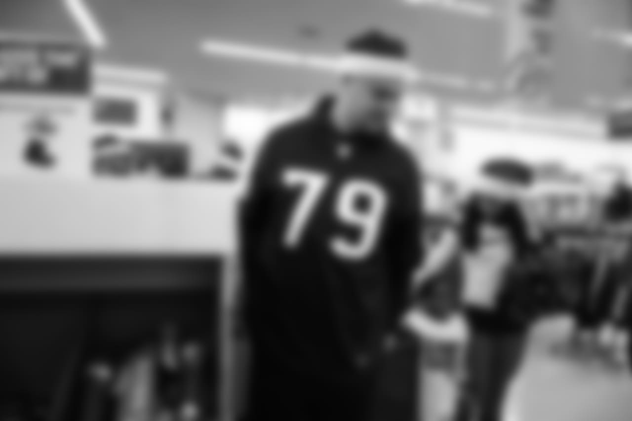 An image from a Dec. 18, 2018 community development event in which Texans rookie players shopped for Christmas gifts with Texans YMCA students.