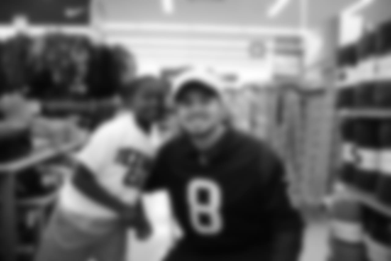 An image from a Dec. 18, 2018 community development event in which Texans rookie players shopped for Christmas gifts with Texans YMCA students.