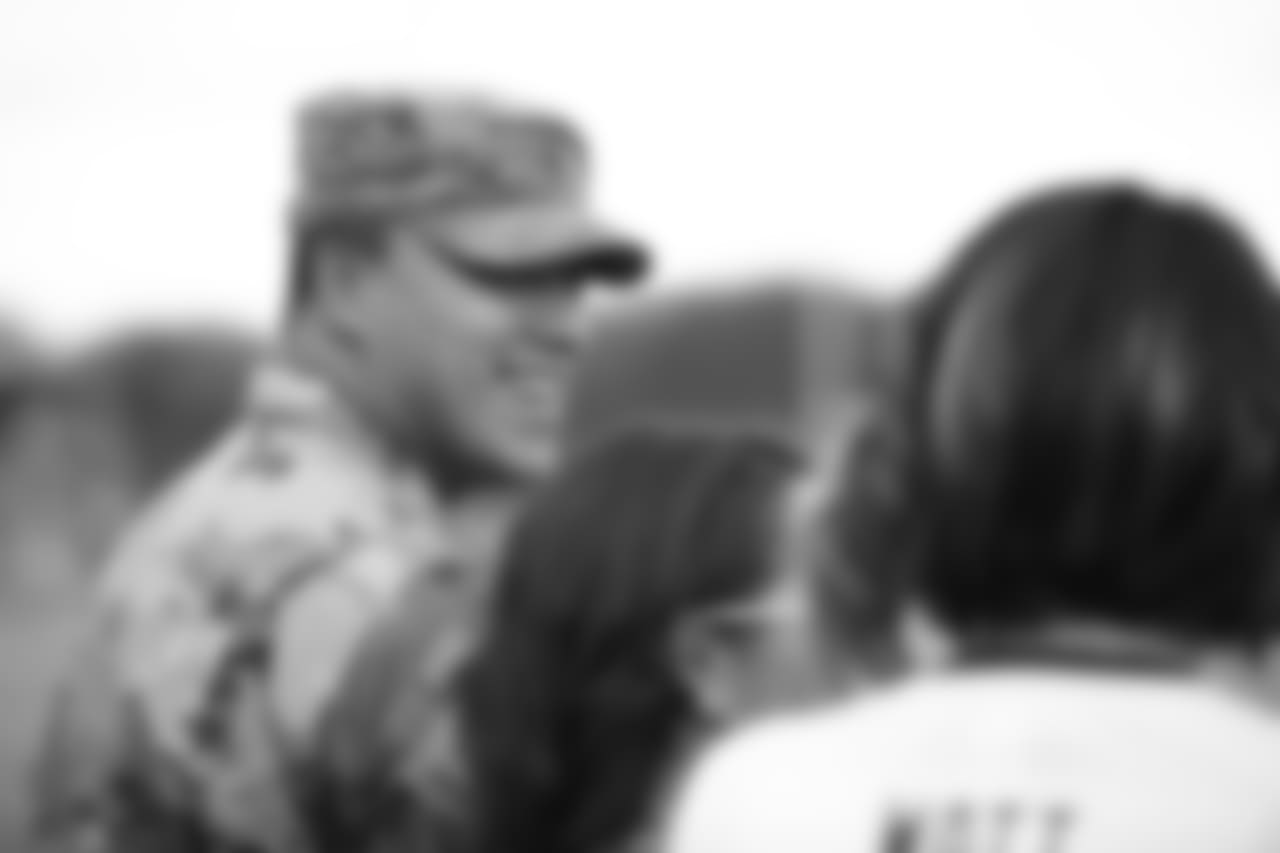 A Nov. 23, 2018 image of a community development event in which military families visited a Texans practice.