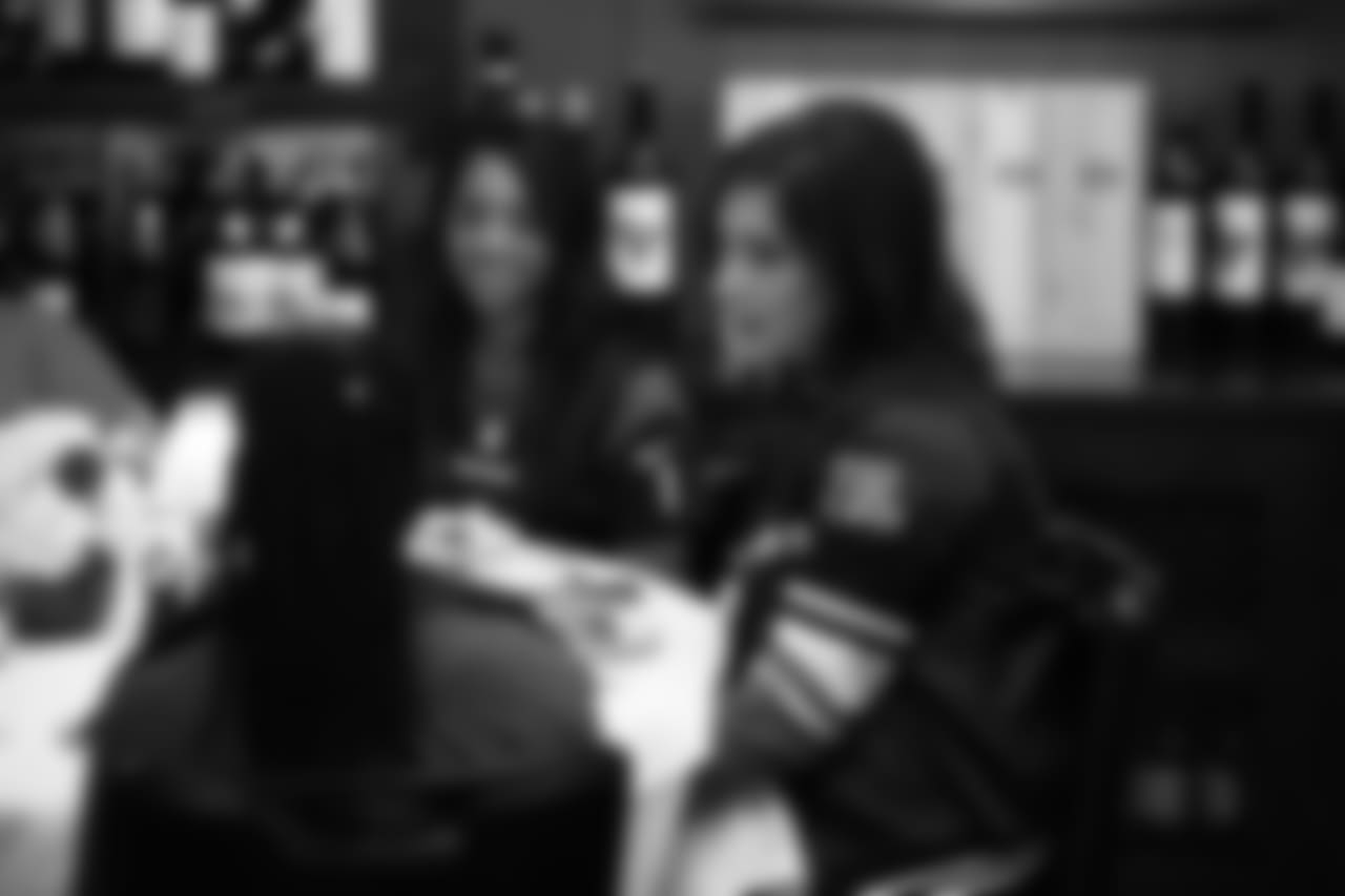 An image from the Oct. 18, 2018 community development event in which the Lady Texans learned about dinner ettiequte with Houston-area students.
