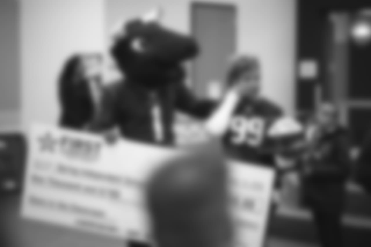 An image from the Nov. 13, 2018 corporate development event at Hirsch Elementary School in Spring, TX. Brian Peters, TORO, and cheerleaders visited the students and presented awards and a big check to teachers.
