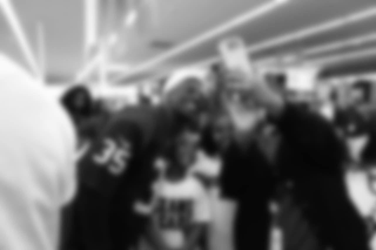 An image from a Dec. 18, 2018 community development event in which Texans rookie players shopped for Christmas gifts with Texans YMCA students.