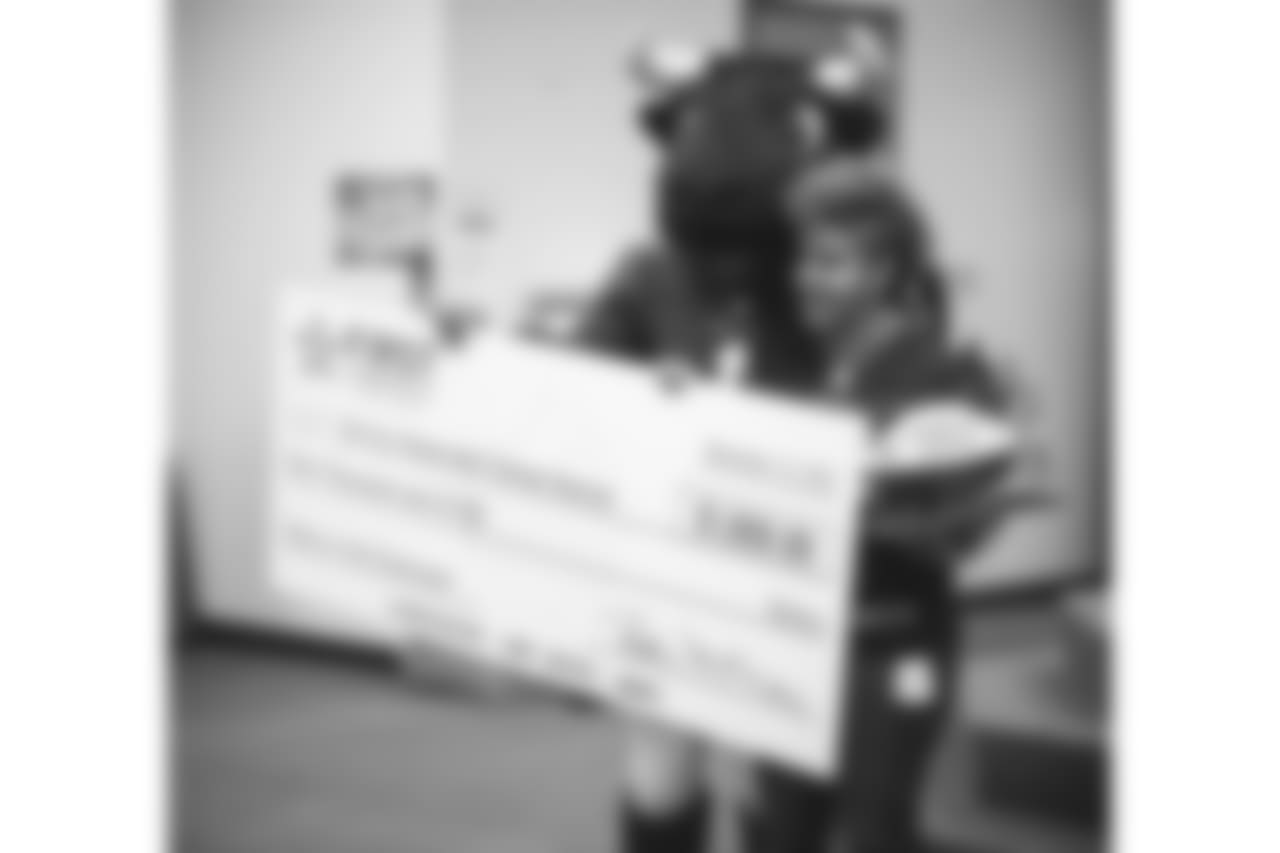 An image from the Nov. 13, 2018 corporate development event at Hirsch Elementary School in Spring, TX. Brian Peters, TORO, and cheerleaders visited the students and presented awards and a big check to teachers.