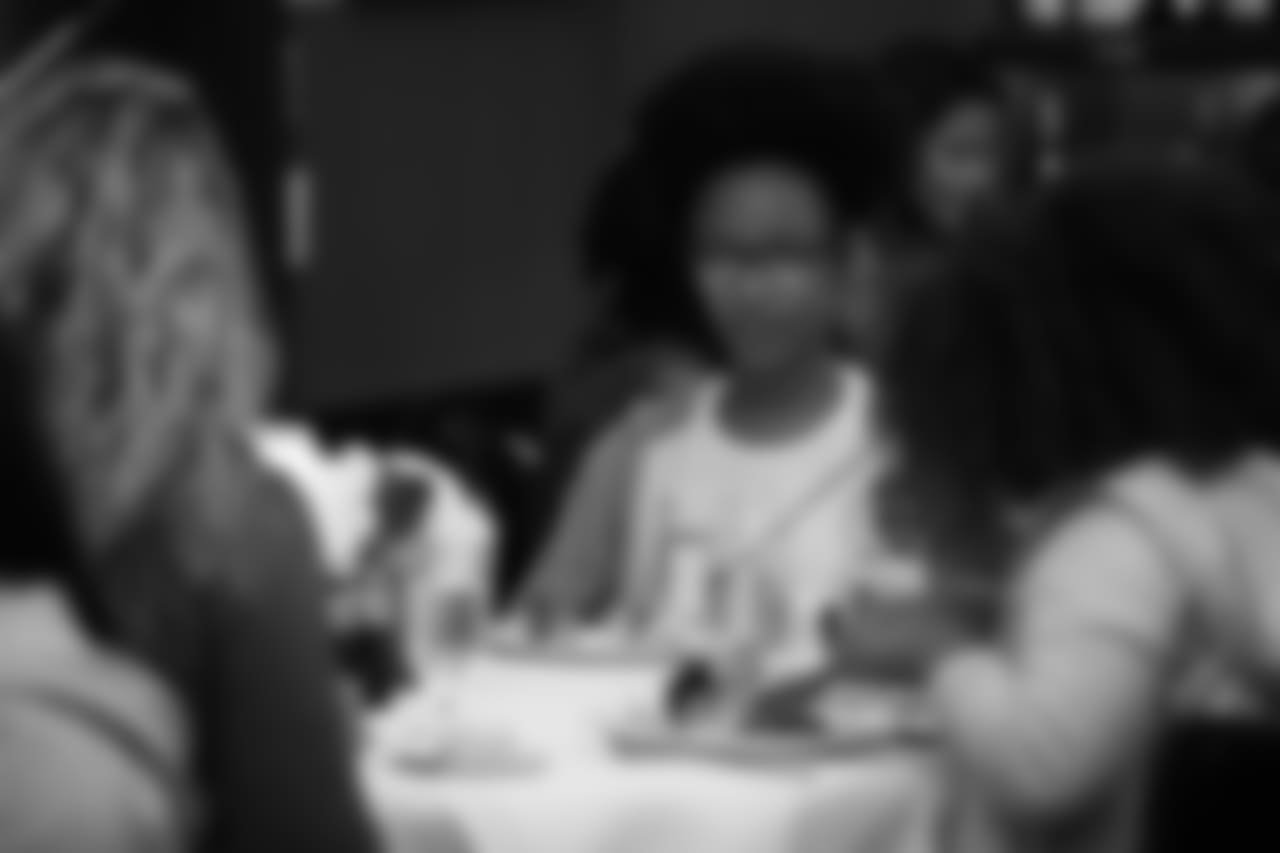 An image from the Oct. 18, 2018 community development event in which the Lady Texans learned about dinner ettiequte with Houston-area students.