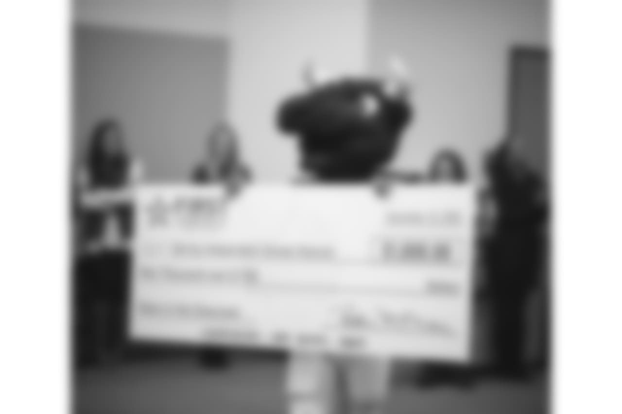 An image from the Nov. 13, 2018 corporate development event at Hirsch Elementary School in Spring, TX. Brian Peters, TORO, and cheerleaders visited the students and presented awards and a big check to teachers.