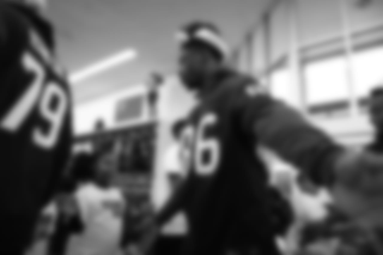 An image from a Dec. 18, 2018 community development event in which Texans rookie players shopped for Christmas gifts with Texans YMCA students.
