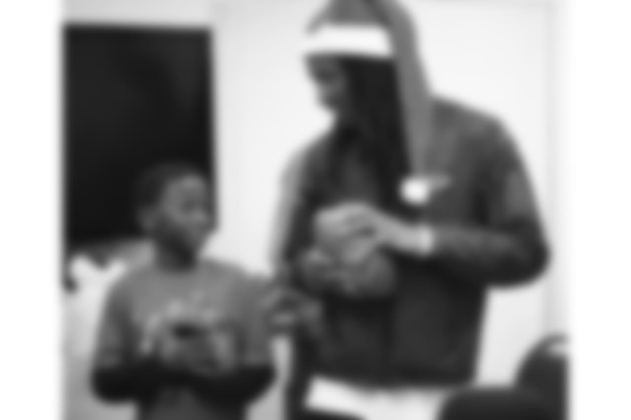 An image from the Dec. 21, 2018 community development event at the Madge Bush Transitional Living Center. Andre Johnson and DeAndre Hopkins gave gifts to families.