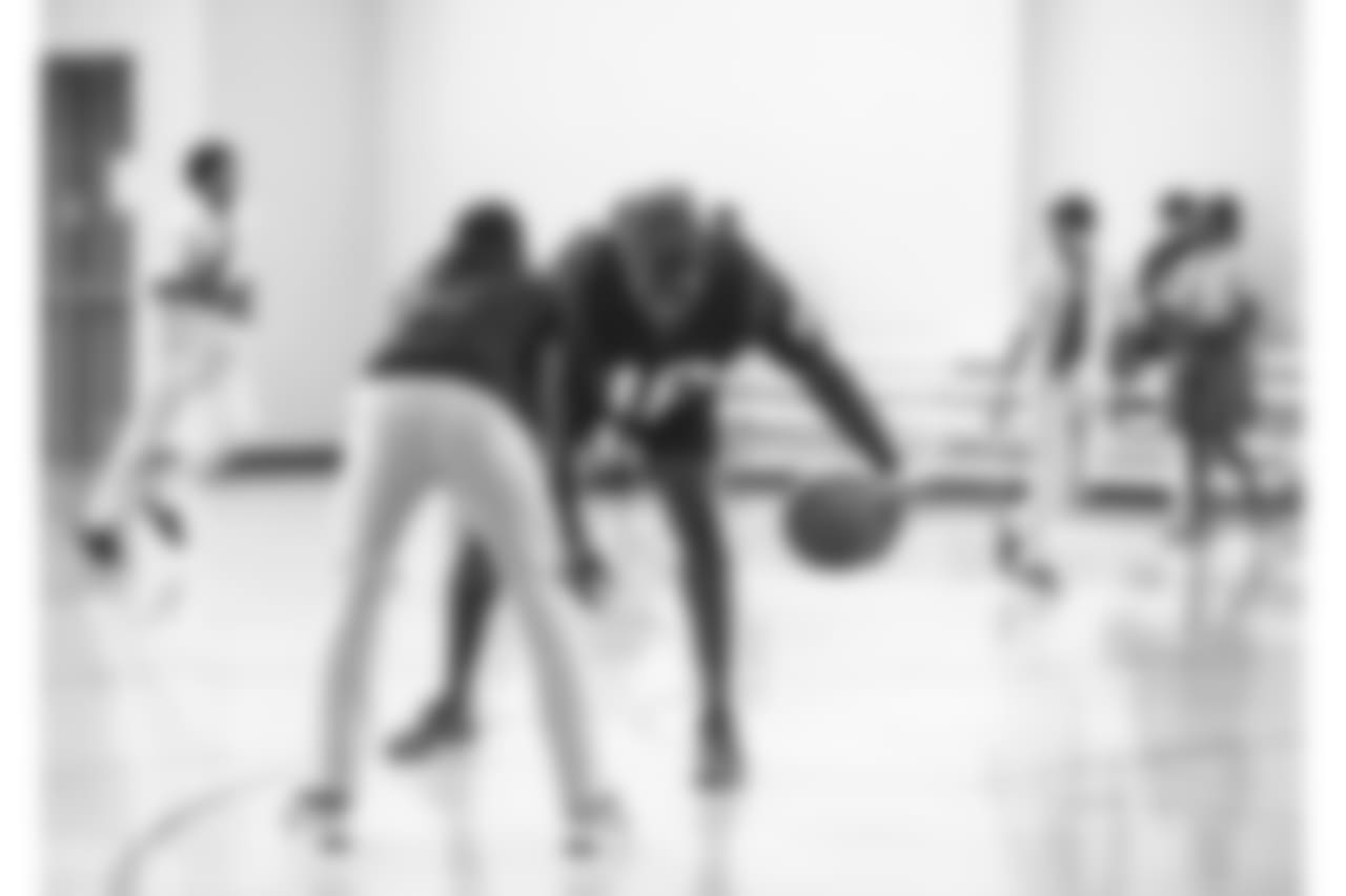 An image from the Sept. 25, 2018 community development event in which Sammie Coates Jr. and Julien Davenport played basketball and ate pizza with local students.