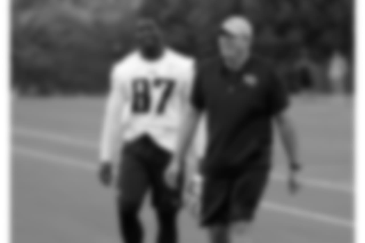 Tennessee Titans tight end Jonnu Smith (87) talks with tight ends coach Arthur Smith during NFL football minicamp Thursday, June 15, 2017, in Nashville, Tenn. (AP Photo/Mark Humphrey)