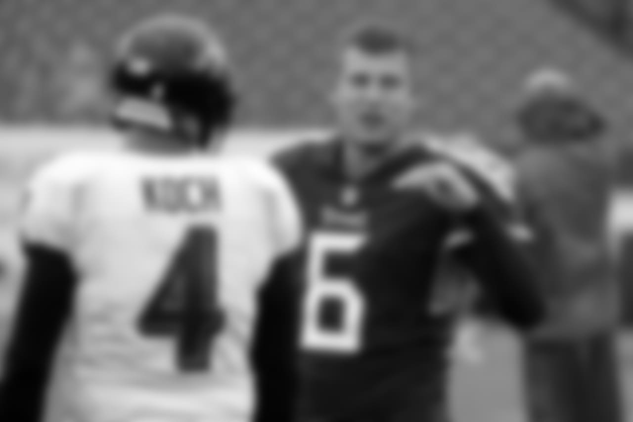 Tennessee Titans punter Brett Kern (6) talks with Baltimore Ravens punter Sam Koch (4) before an NFL football game Sunday, Oct. 14, 2018, in Nashville, Tenn. (AP Photo/James Kenney)